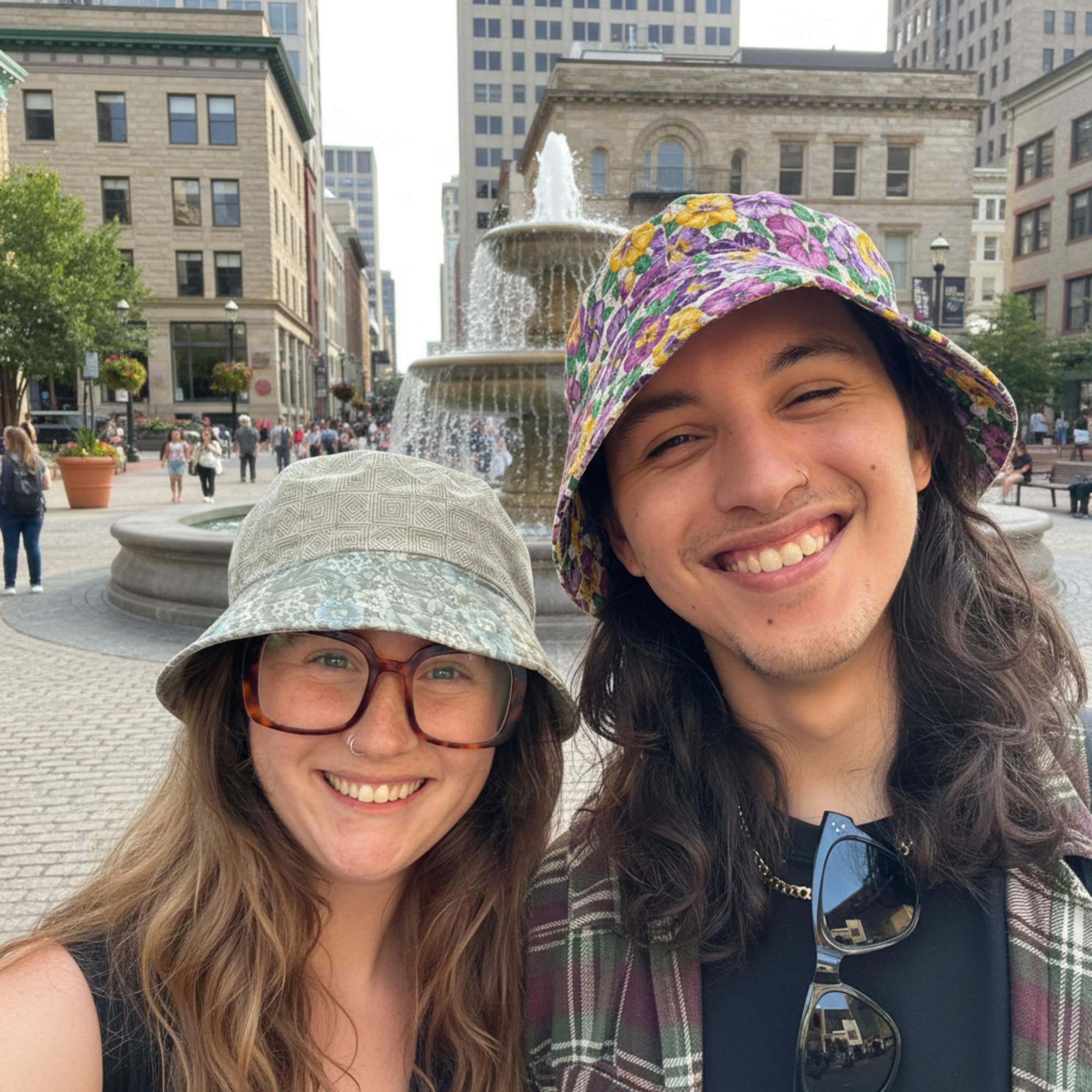 Couple wearing bucket hats while walking, showing easy everyday style and comfort.
