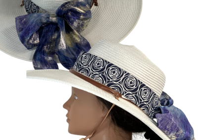 Floppy hat band with long fancy ties tied into an oversized bow for dramatic flair.
