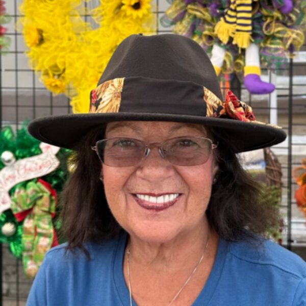 Black cowboy hat worn with mums patterned floppy hat band