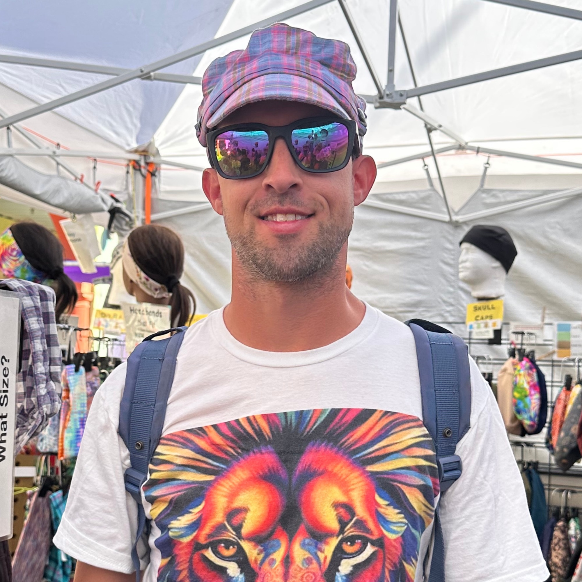 Plaid Fisherman Cap at Street Fair Man wearing plaid fisherman cap at Tucson street fair