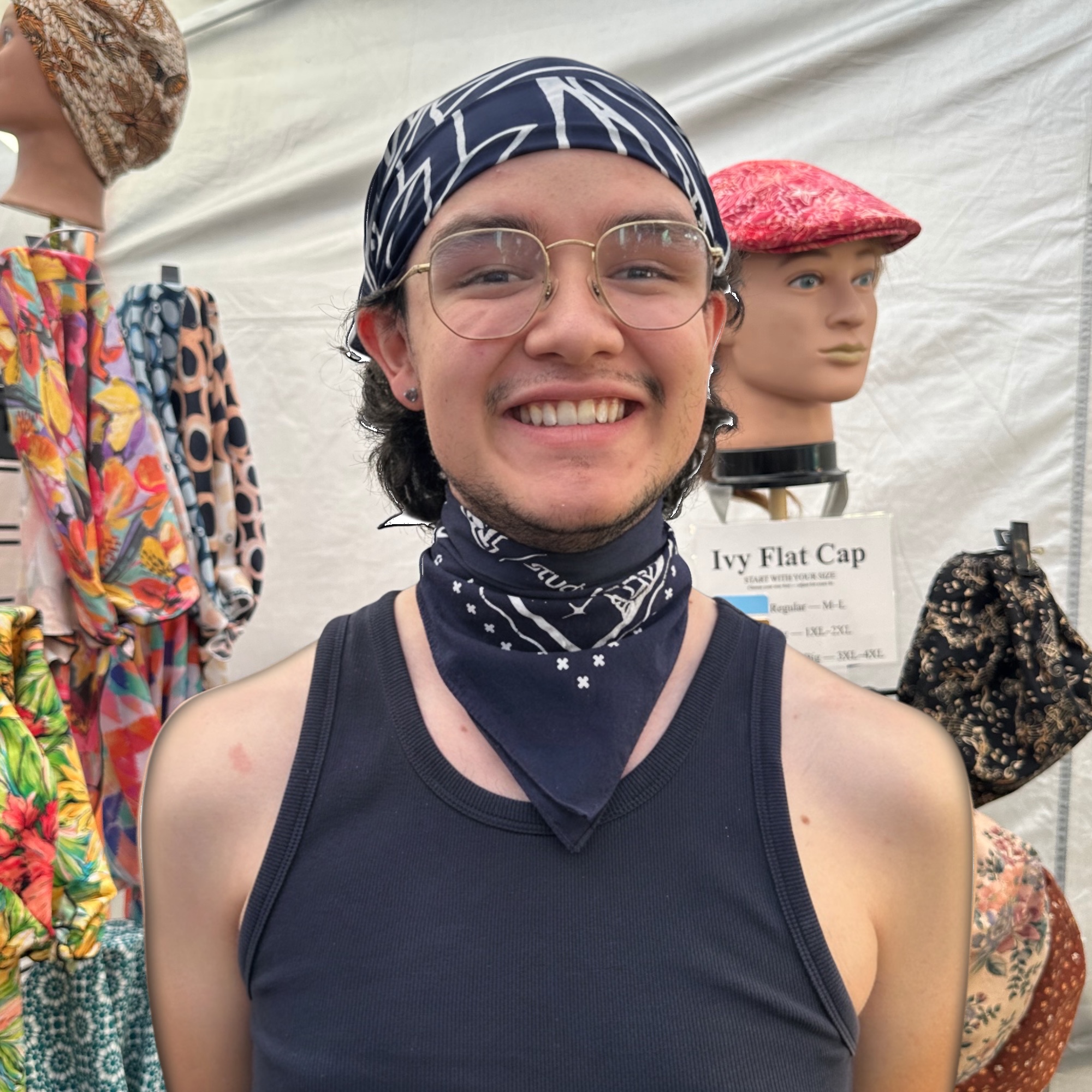 Navy Head Wrap on Customer at Street Fair Man wearing navy and white head wrap at Tucson street fair