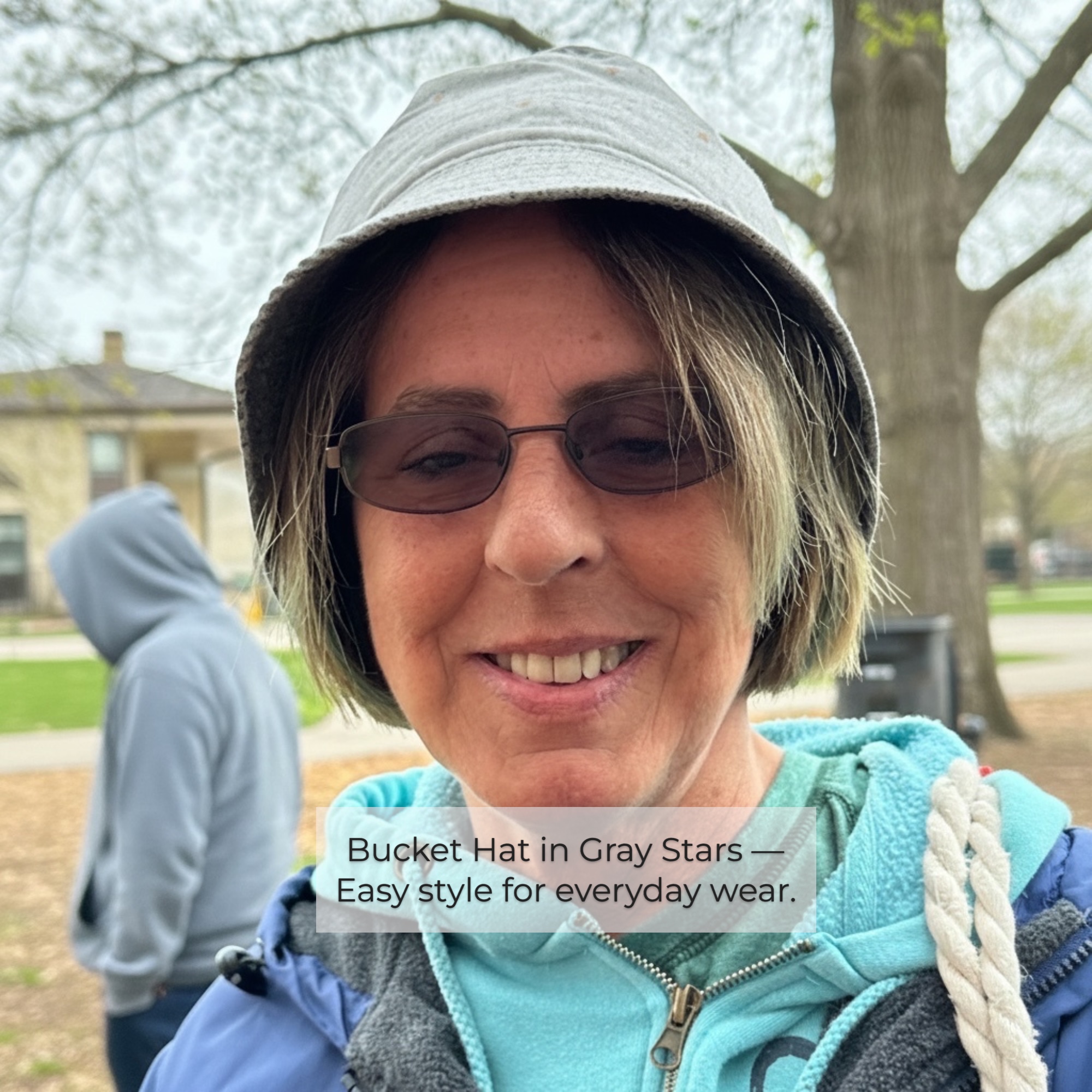 Gray Bucket Hat – Gardening Comfort Woman wearing a gray bucket hat outdoors, chosen for gardening after retirement.