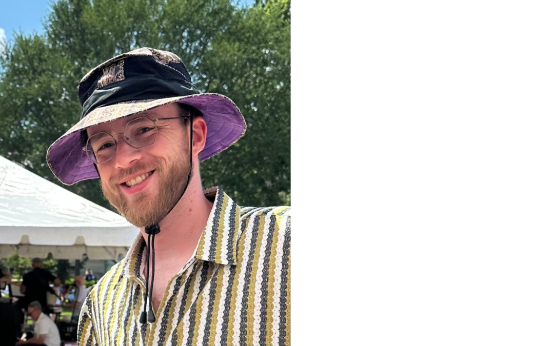 Customer smiling while wearing a handcrafted Big Boonie Hat at the Iowa City Jazz Festival in Iowa City, Iowa.